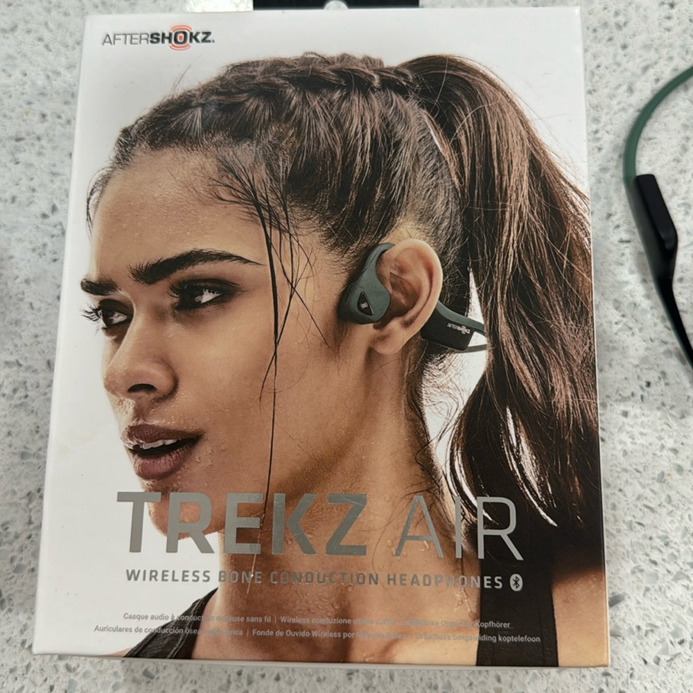 Aftershokz Trekz Air Headphones used but works great.Original box with charger.